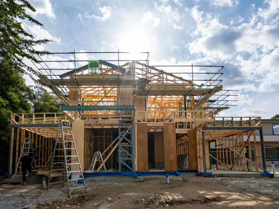 Double-storey home at frame stage with scaffolding