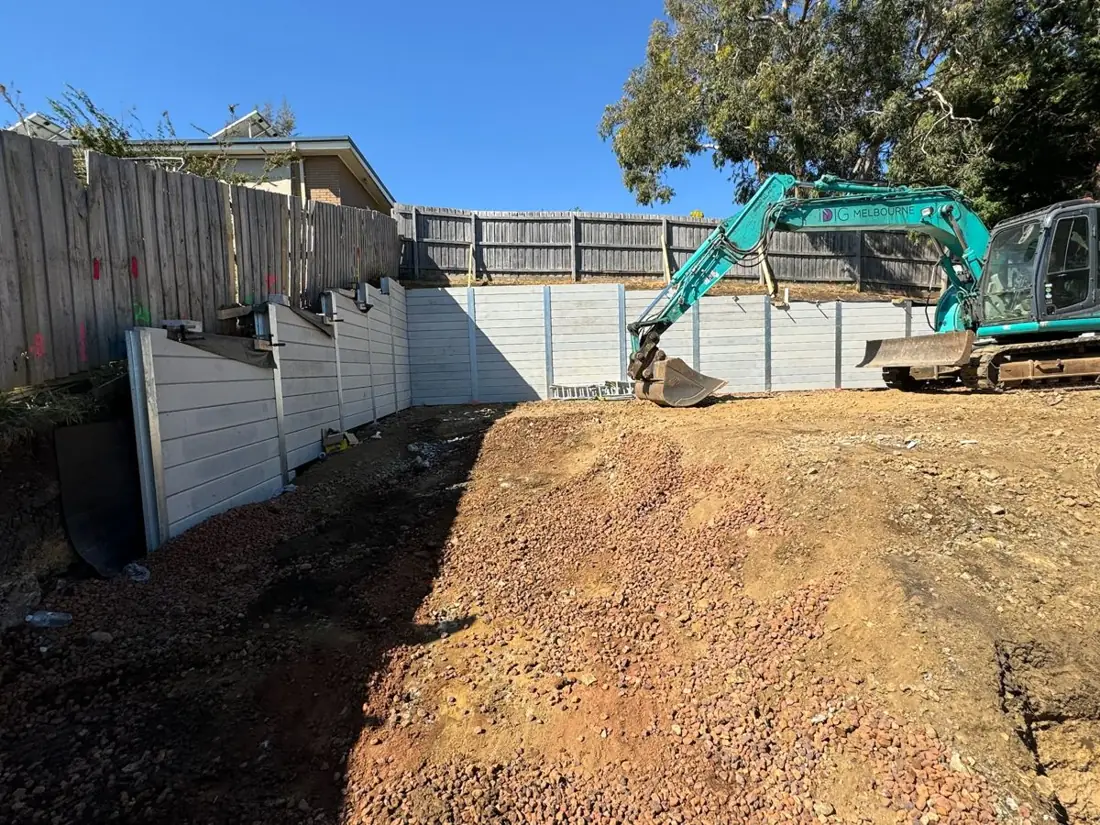Sloping block cut and retained with concrete sleeper walls, ready for the build